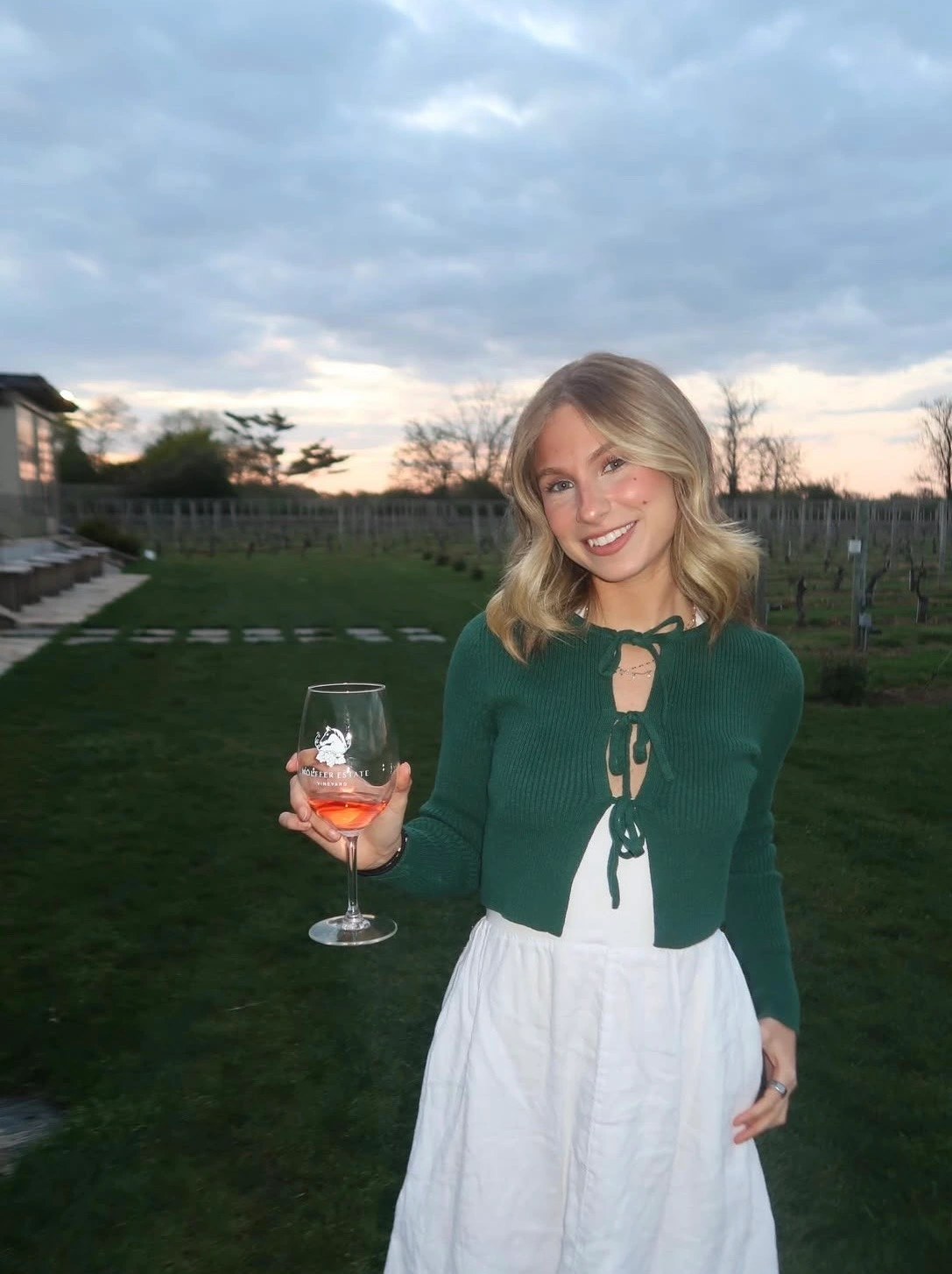 Green hoodie in the brick-walled side yard